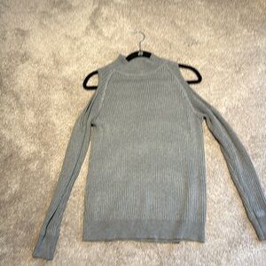 Women’s sweater with cutout shoulder